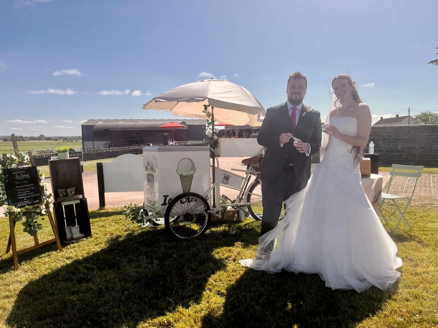 Bride and groom enjoying ice cream